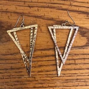 Gold triangle earrings.